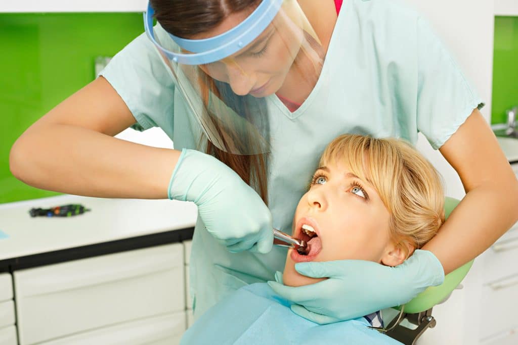 How Do You Stop Bleeding After A Tooth Extraction? Suwanee Family Dentistry PC