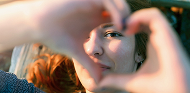 Lady Making Heart Shape With Hands